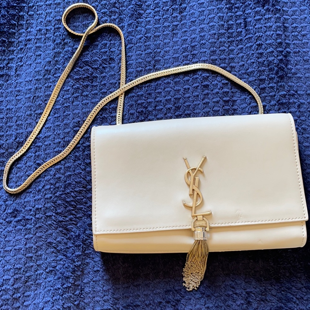 Nude designer inspired clutch with gold chain.